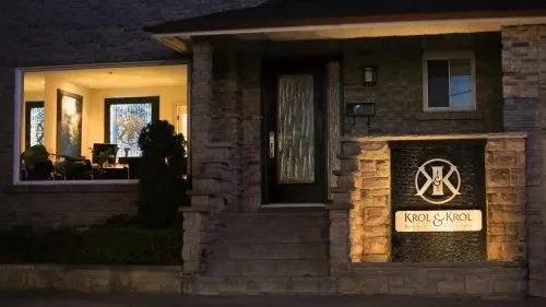 Exterior of Krol & Krol office illuminated at night.