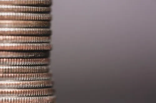 Close-up of a stack of coins with a blurred background.